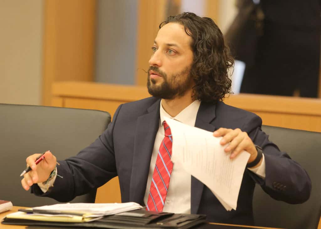 San Diego Inn of Court Workshop practice A man in a suit participates in a San Diego Inn of Court Workshop practice
